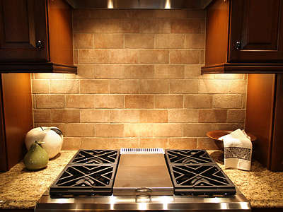 small stone subway tile backsplash